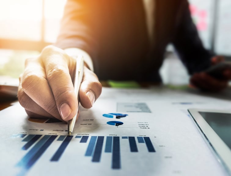 An investor reading financial charts